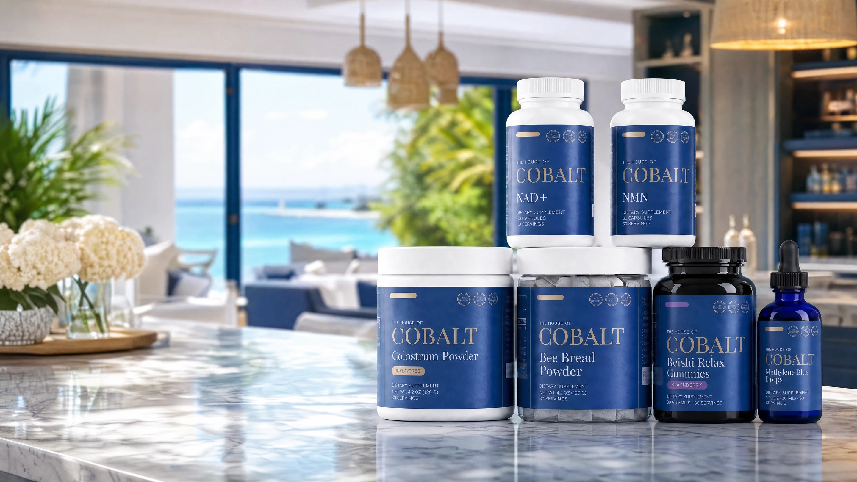 The House of Cobalt collection — NMN, NAD+, Colostrum, Bee Bread, Reishi gummies and Methylene Blue on a kitchen counter